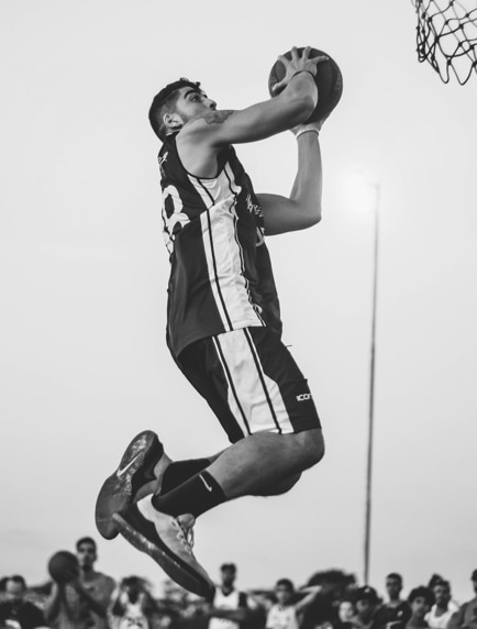player throwing the ball into the basket