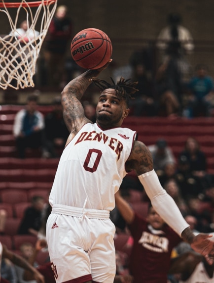 the player throwing the ball into the basket.